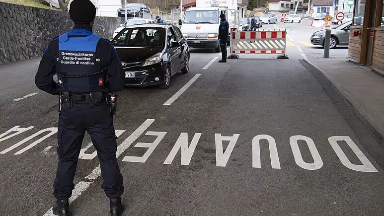 Police officers at a customs checkpoint
